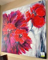 Full view of square canvas painting with three red poppy blooms, artist initials visible