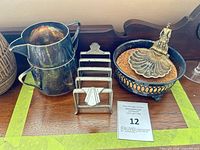 Overview showing creamer, toast rack, pierced bowl with shell dish