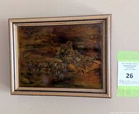 Framed metal etching on wall