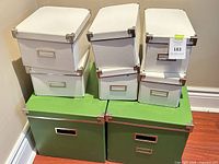 Front view showing all eight IKEA KASSETT boxes stacked
