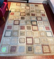 Full view of Interlude Jonas rug showing geometric square pattern and overall condition