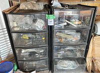 Front view of both plastic drawer units with visible hardware contents