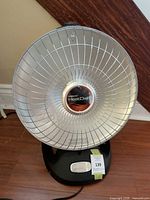 Front view of Presto HeatDish heater showing reflector and base