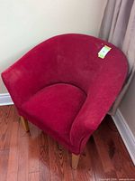 Full view of red tub chair front angle