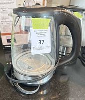 Front view of Salton glass kettle showing handle, power cord and glass body