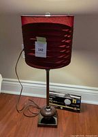 Full view of lamp showing shade, pole, base and cord