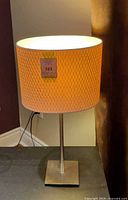 Full view of lamp showing shade, stem and base