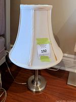 Front view of table lamp showing shade and base