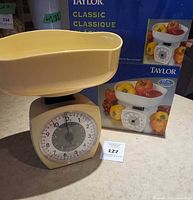 Scale with bowl atop and original box in background