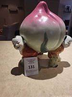 Front view showing full figurine and scale tag