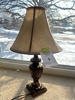 Full view of lamp showing base, shade, cord