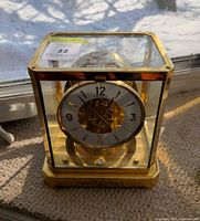 Front view of Jaeger-LeCoultre Atmos clock showing dial and case