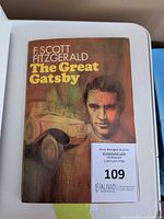 Front cover showing title, author, illustration, auction tag