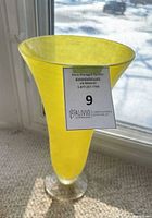 Full view of yellow milk glass tulip vase showing clear foot