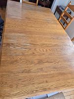 top view of oak dining table surface showing grain and leaf seam