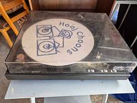 Front three-quarter view of Gemini XL-DD20 turntable with dust cover closed