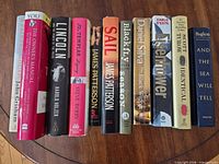 All 12 books standing spine-out on table