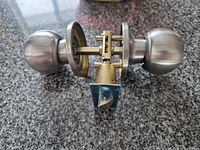 door knob set outside packaging showing finish and latch