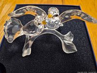 Top view of faceted crystal turtledoves on frosted branch base