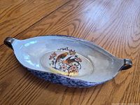 Oval bird motif relish dish, top view