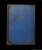 Front cover showing cloth, gilt signature, staining