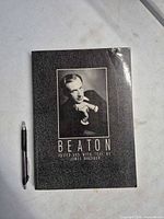 Front cover of book with pen for scale