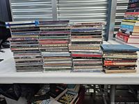 Full view of three stacks of CDs on table