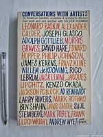 Front cover showing title, subtitle and multicolour artist name design