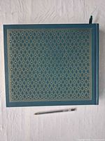 Front cover showing teal cloth and gold diamond tooling