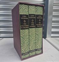 Spines of three volumes inside slipcase showing titles and publisher