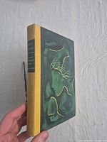 Front cover of cloth-bound book with branch design