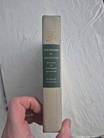 Spine showing title, editor, publisher emblem