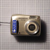 Front view showing lens, flash, spec sticker and model marking