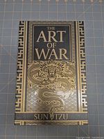 Front view of slipcase with title and dragon design