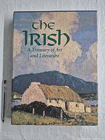 Front cover showing title, artwork, size reference pen