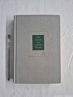 Front cover of the gray cloth hardcover with green title block