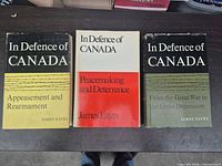 Front dust jackets of three of the books showing titles and author