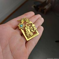 Front view of brooch in hand