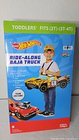Front of boxed Hot Wheels Ride-Along Baja Truck toddler costume
