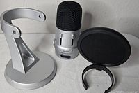 Microphone, stand base and yoke, pop filter, mounting ring