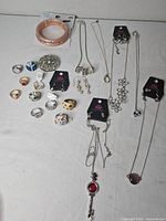 Overview of all jewellery laid out on white surface