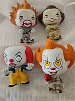 Group shot of four Pennywise vinyl figures