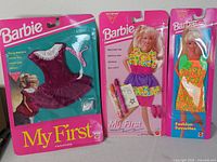 All three sealed Barbie fashion packs front view