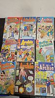 First set of vintage Archie universe comics laid out, cover art visible