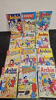 Front view of twelve Archie-related comics displayed on a surface
