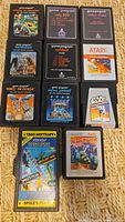 All 11 Atari 2600 game cartridges laid out in rows showing titles and label art