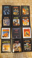 Front view of all twelve Atari 2600 game cartridges arranged in a 4x3 grid