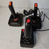 Two PointMaster joysticks and one rapid-fire joystick on table