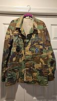 Front view of Propper USAF woodland BDU shirt with patches