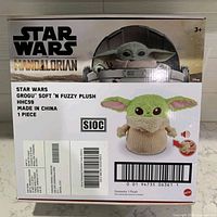 Front of box showing Grogu Soft 'N Fuzzy plush branding and UPC
